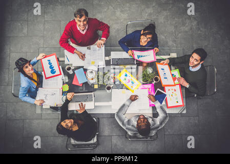 Successful business team in a meeting conference room, concepts about teamwork and business - Team brainstorming in a modern start up office Stock Photo