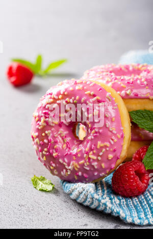 Pink donuts on gray background Stock Photo