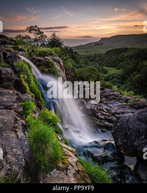 Sunset at the Loup of Fintry waterfall north of Glasgow Scotland Stock Photo
