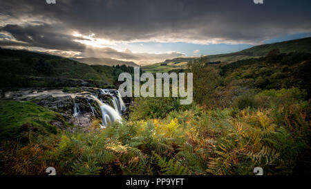 Sunset at the Loup of Fintry waterfall north of Glasgow Scotland Stock Photo