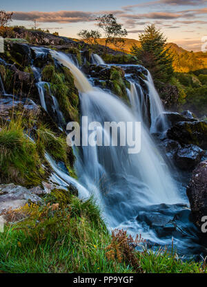 Sunrise at the Loup of Fintry waterfall north of Glasgow Scotland Stock Photo