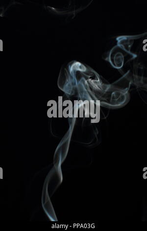 Abstract white smoke texture on black background Stock Photo