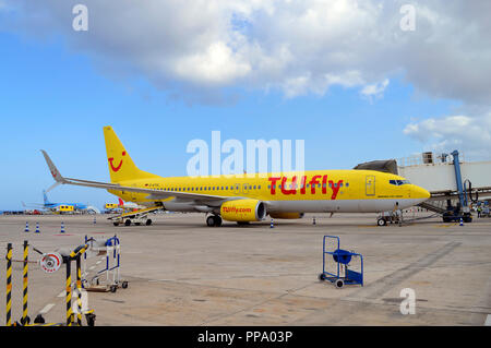 Passengers disembarking form a TUI fly Boeing 737 800 aircraft in Fuerteventura airport Stock Photo