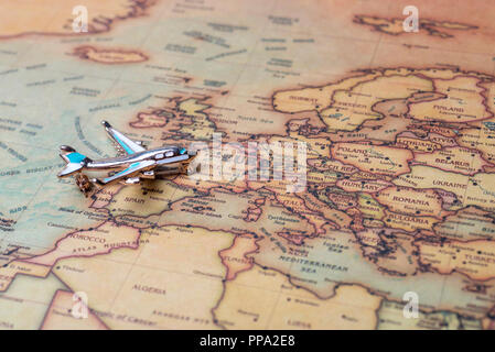 Airplane over the map of Europe. Toy airplane on the map background. Stock Photo
