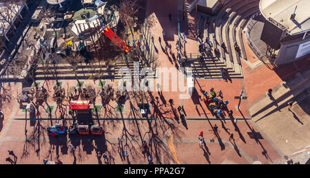 People are on move in Cape tow, South Africa, street musicians playing music. Areal view from Victoria & Alfred Waterfront. Stock Photo