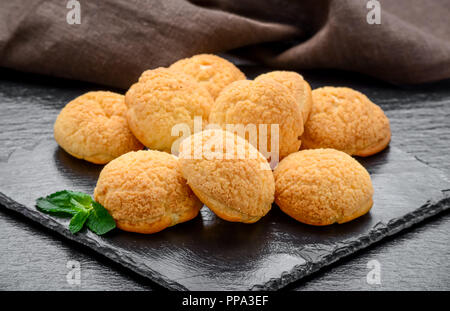 Amaretti cookies in a glass bowl on old wooden background Stock Photo