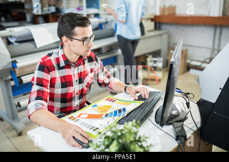 Designer working on computer in office Stock Photo