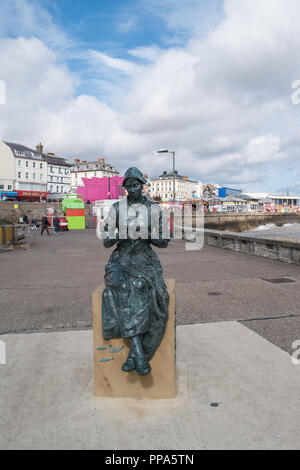 An image of The Gansey Girl a bronze statue by Artist Steve Carvill  created as part of the Maritime Trail on the North Pier, Bridligton. Stock Photo