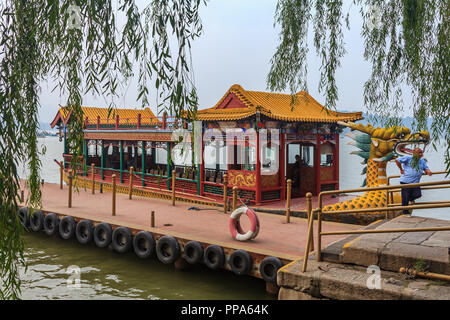 Dragon boat on the Kunming Lake, Beijing, China at Beihai Park pavilion. Former imperial garden (near Forbidden City) built in 11th century, one of th Stock Photo