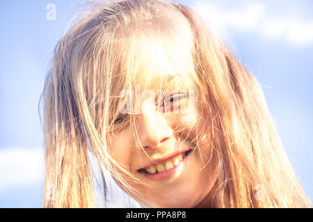 Cute smiling beautiful kid girl sunny portrait with hair cut disaster lifestyle concept happiness Stock Photo