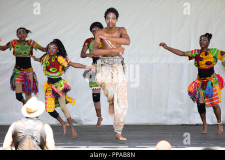 St. Louis, Missouri, USA - August 26, 2018: The Festival of Nations, Men women and children from the Kummba youth Performance Ensemble, perform tradit