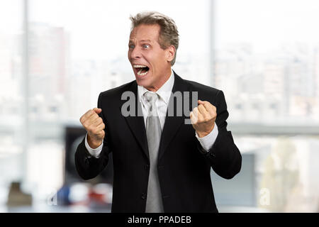 Stressed businessman clenched fists in desperation. Stock Photo