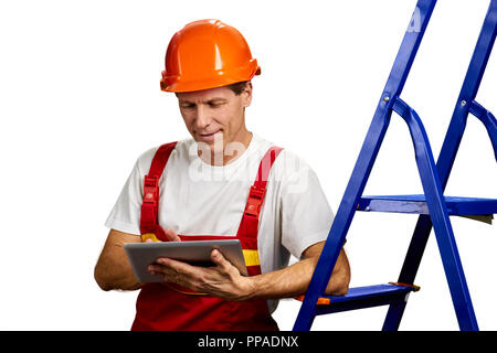 Handsome foreman using digital tablet. Stock Photo