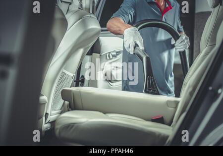 Professional vacuum cleaner at car detailing garage Stock Photo - Alamy