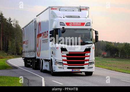 SALO, FINLAND - SEPTEMBER 21, 2018: Next Generation Scania R500 freight truck of Ahola transport hauls goods along highway in evening light. Stock Photo