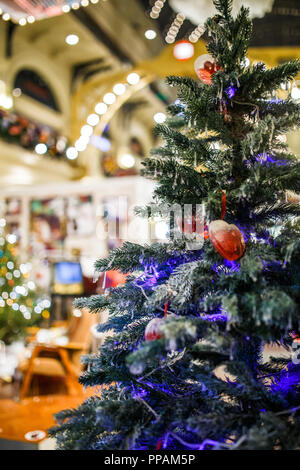 Photo of decorated Christmas tree in store Stock Photo
