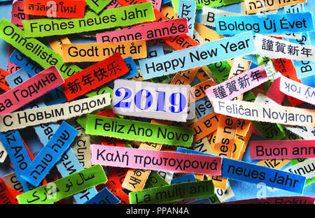 Happy New Year 2019 Word Cloud printed on colorful paper different languages Stock Photo