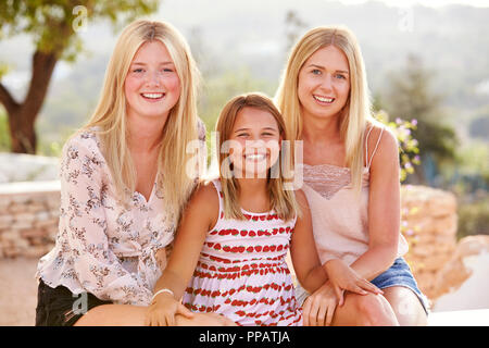 Portrait Of Three Sisters Having Fun On Holiday Together Stock Photo