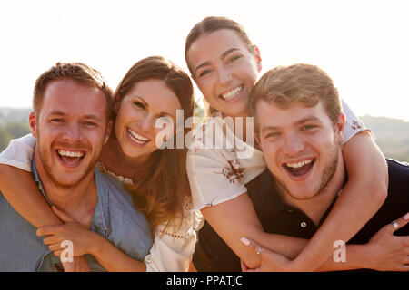 Portrait Of Young Couples Having Fun On Holiday Together Stock Photo