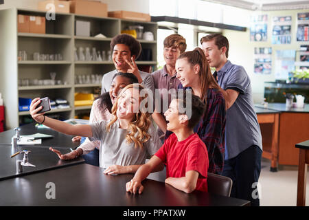 Group Of High School Students Taking Selfie In Biology Classroom Stock Photo