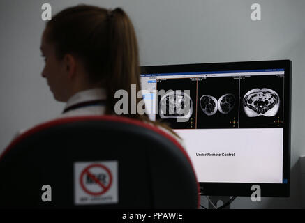 Embargoed to 1700 Monday September 24 Gillian Smith, MR Linac Radiographer, monitors the treatment of patient Barry Dolling, aged 65, from Selsdon, Surrey, who was diagnosed with prostate cancer in April 2018, and became the first patient in the UK to receive a pioneering new form of radiotherapy - using a Magnetic Resonance Linear Accelerator (MR Linac) machine - at the Royal Marsden Hospital in Sutton Surrey. Stock Photo