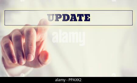 Close up Human Hand Pointing Update Text in Transparent Box, Isolated on White Background. Stock Photo