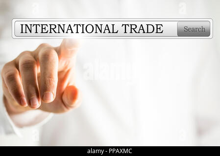 Close-up of a hand clicking a bar button to search for international trade on a virtual screen, with copy space Stock Photo