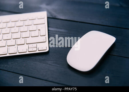 Computer keyboard and mouse on office desk Stock Photo