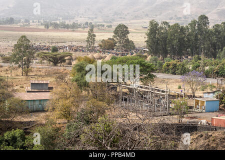 Hydro-electric plant, Tis Abay (Smoke of the Nile) aka Tis Isat (Water that Smokes), with market in background, Blue Nile waterfallls, Ethiopia Stock Photo