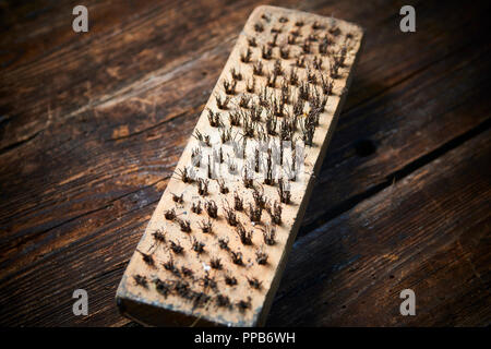 Rusty steel brush close up. Selective focus Stock Photo