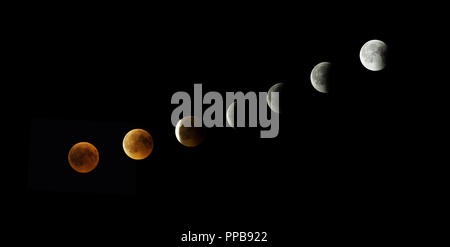 Blood Moon steps out of Earth's shadow, total lunar eclipse on 27.7.2018, Munich, Germany Stock Photo