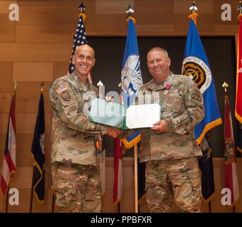 Maj. Gen. Kirk Vollmecke, left, the Program Executive Officer for ...