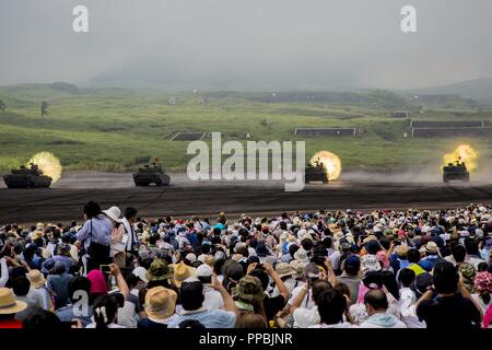 COMBINED ARMS TRAINING CENTER CAMP FUJI, GOTEMBA, Japan – A Japan Ground Self-Defense Force Type-10 tank fires at long-range targets during the annual Fuji Firepower Demonstration Aug. 26 on Combined Arms Training Center Camp Fuji, Gotemba, Japan. The demonstration brought members of the local and U.S. communities together to observe and gain a better understanding of their capabilities in regards to the defense of Japan. First open to the public in 1966, the JGSDF uses this annual exercise to improve public understanding of their capabilities. Stock Photo