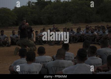 Sri Lanka – U.S. Marines with the 13th Marine Expeditionary Unit (MEU) and Sri Lankan Navy Marines participate in physical training together to build comradery and partnership while on a regularly scheduled deployment of the Essex Amphibious Ready Group (ARG) and 13th MEU, August 26, 2018. The San Antonio-class amphibious transport dock USS Anchorage (LPD 23) and the embarked Marines of the 13th MEU conducted a theater security cooperation exercise with the Sri Lankan Navy and Navy Marines.  Part of a growing U.S.-Sri Lanka naval partnership, the exercise was also an opportunity for U.S. Seven Stock Photo