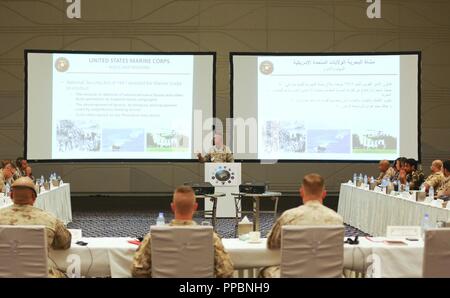 ABU DHABI, United Arab Emirates (Aug. 27, 2018) – U.S. Marine Corps Sgt. Maj. William T. Thurber, sergeant major of Marine Corps Forces Central Command (MARCENT), briefs participants on the structure of the United States Marine Corps during the 2018 Regional Marine Symposium. The Regional Marine Symposium is the exclusive forum for regional cooperation amongst marine and naval infantry forces that focuses on improving the alignment of mission sets to regional threats in order to advance U.S. Central Command and MARCENT security cooperation objectives. Stock Photo