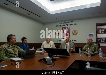 From Left, Lt. Col. Larry Ray, exercise branch chief, 416th Theater Engineer Command; Gary Timmins, military legislative assistant to Congressman William Foster; Reserve Ambassador William Hawes; Representative Bill Foster, D-Ill.; and Brig. Gen. Matthew Baker, deputy commanding general, 416th Theater Engineer Command discuss the capabilities of the 416th TEC, Darien, Ill., August 29th, 2018 Stock Photo