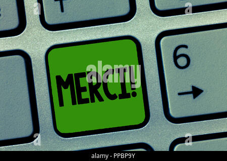 Handwriting text Merci. Concept meaning defined as thank you in French language Being grateful to someone. Stock Photo