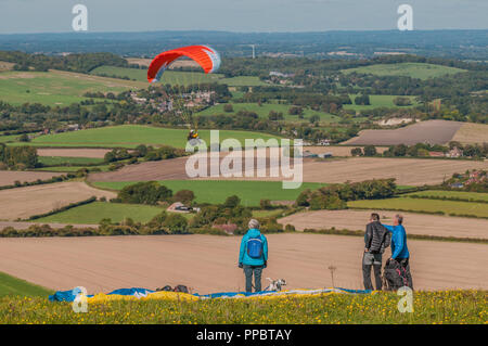 Firle, Lewes, East Sussex, UK..24 September 2018..Glorious day with cooler wind from the North brought paraglider pilots to Firle beacon in the beautiful South Downs. Stock Photo