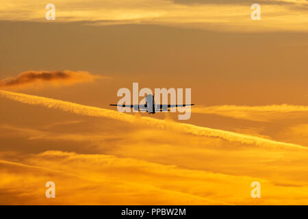 Luton Airport, London, UK. 24th Sep 2018. UK Weather: A silhouette of on Airbus A320 taking off at sunset Credit: Nick Whittle/Alamy Live News Stock Photo