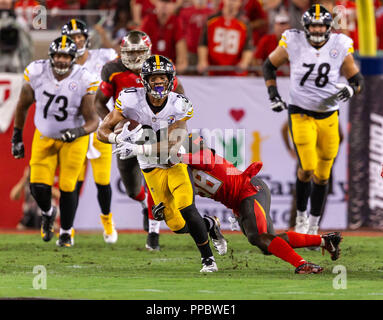 Tampa, Florida, USA. 24th Sep, 2018. Tampa Bay Buccaneers outside linebacker Kwon Alexander (58) tackles Pittsburgh Steelers running back James Conner (30) after making the catch in the 1st half during the game between the Pittsburgh Steelers and the Tampa Bay Buccaneers at Raymond James Stadium in Tampa, Florida. Del Mecum/CSM/Alamy Live News Stock Photo