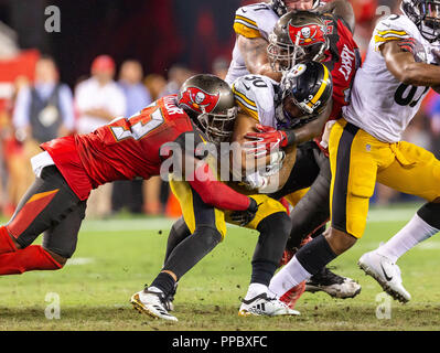 Tampa, Florida, USA. 24th Sep, 2018. Pittsburgh Steelers running back James Conner (30) gets tackled at the line of scrimmage in the 2nd half during the game between the Pittsburgh Steelers and the Tampa Bay Buccaneers at Raymond James Stadium in Tampa, Florida. Del Mecum/CSM/Alamy Live News Stock Photo