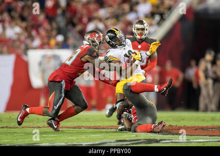 Tampa, Florida, USA. 24th Sep, 2018. Pittsburgh Steelers running back James Conner (30) is brought down by Tampa Bay Buccaneers linebacker Lavonte David (54) during the game at Raymond James Stadium on Monday September 24, 2018 in Tampa, Florida. Credit: Travis Pendergrass/ZUMA Wire/Alamy Live News Stock Photo
