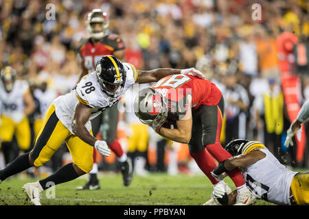 Tampa, Florida, USA. 24th Sep, 2018. Tampa Bay Buccaneers tight end Cameron Brate (84) is brought down by Pittsburgh Steelers defensive back Marcus Allen (27) and linebacker Vince Williams (98) at Raymond James Stadium on Monday September 24, 2018 in Tampa, Florida. Credit: Travis Pendergrass/ZUMA Wire/Alamy Live News Stock Photo