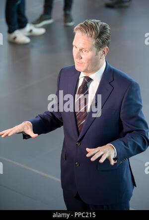 Labour Party Annual Conference 2018, Albert Docks, Liverpool, England, UK. 25th. September, 2018. Keir Starmer M.P. Shadow Secretary of State for Exiting the European Union  talking to the T.V. and press before his main speech on Brexit and the Economyat the Labour Party Annual Conference 2018. Alan Beastall/Alamy Live News Stock Photo