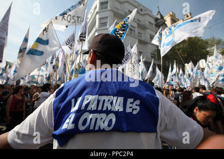 Buenos Aires, Argentina. 24th Sep, 2018. 'The home country is the other,' said a demonstrator on a T-shirt in a protest against the conservative government's austerity policy. The Argentine Federation of Trade Unions has called for a national strike over President Macri's economic policies. The protest is directed against austerity measures that the government has agreed with the International Monetary Fund (IMF). Credit: Claudio Santisteban/dpa/Alamy Live News Stock Photo