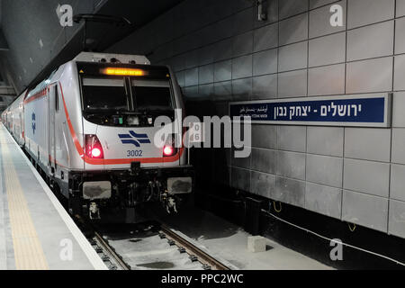 Jerusalem, Israel. 25th September, 2018. Commuters board the train and await departure to Tel Aviv at Jerusalem's new Yitzhak Navon Station, with platforms situated 80m below ground level. The new Jerusalem Tel Aviv 'King David' train line, Israel Rail Project A1, designed to connect Israel's capital to the Greater Tel Aviv metropolitan area, begins commercial operation today. Credit: Nir Alon/Alamy Live News Stock Photo