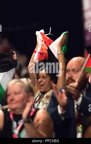 Liverpool, UK. 25th Sep 2018. Labour Party Annual Conference 2018, Albert Docks, Liverpool, England, UK. 25th. September, 2018. Supporters for Free Palestine wave the Palestine flag at the Labour party Conference.Labour Party Annual Conference 2018. Alan Beastall/Alamy Live News Stock Photo