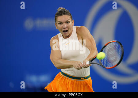 Wuhan. 25th Sep, 2018. Simona Halep of Romania returns a shot to Dominika Cibulkova of Slovakia