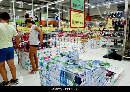Sofia, Bulgaria, August 17,2018:young boy and girl looking at pencils, notebooks behind them, school supplies in a supermarket, back to school concept Stock Photo