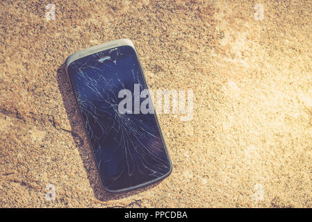 Broken screen of the cellphone or smartphone. Black cracked Touch Screen Phone Stock Photo